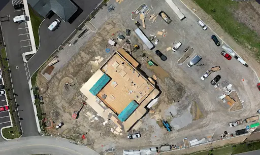 Nadir view of well lit construction site with minimal shadows and high, full sun.